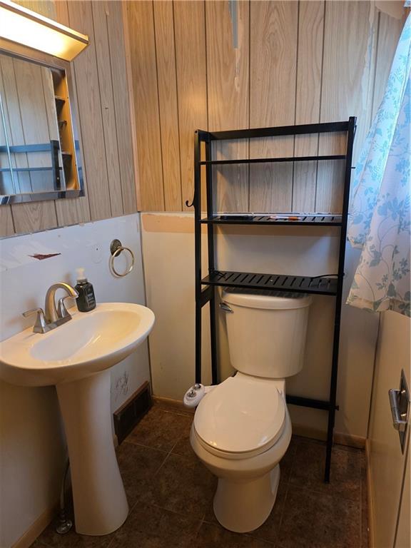 35 Beallsville Road Fredericktown, PA 15333 - Photo 16 of 24 a white toilet sitting next to a bathroom sink