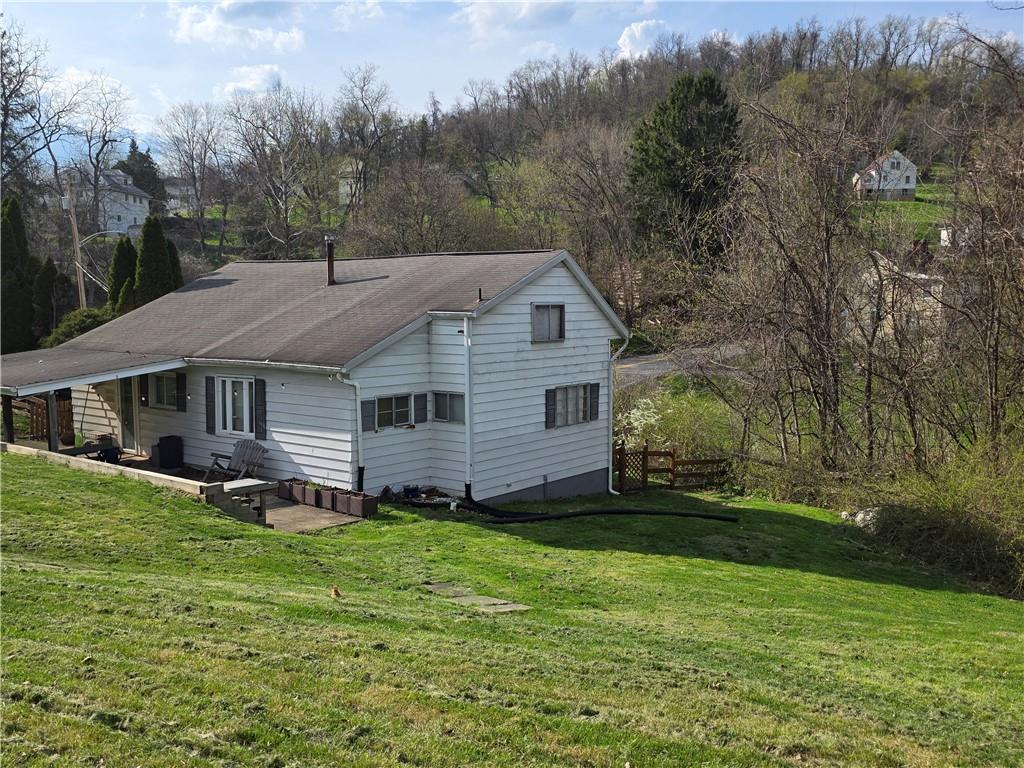 35 Beallsville Road Fredericktown, PA 15333 - Photo 3 of 24 a aerial view of a house next to a big yard and large trees