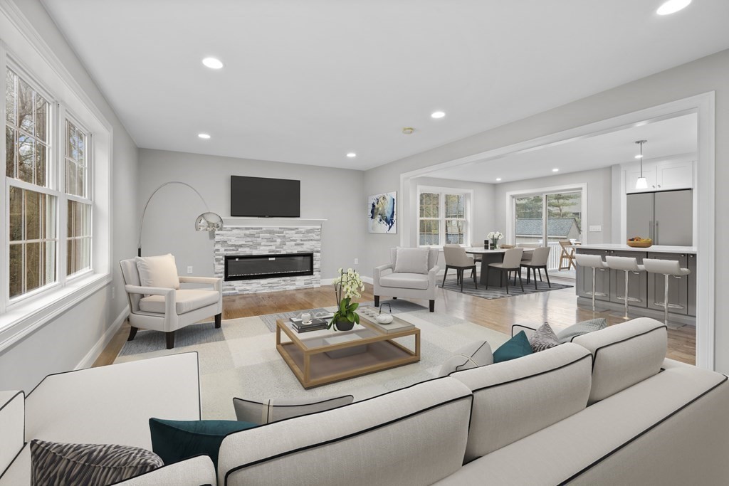 48 Aldrich Road Wilmington, MA 01887 - Photo 11 of 42 a living room with furniture fireplace and a flat screen tv