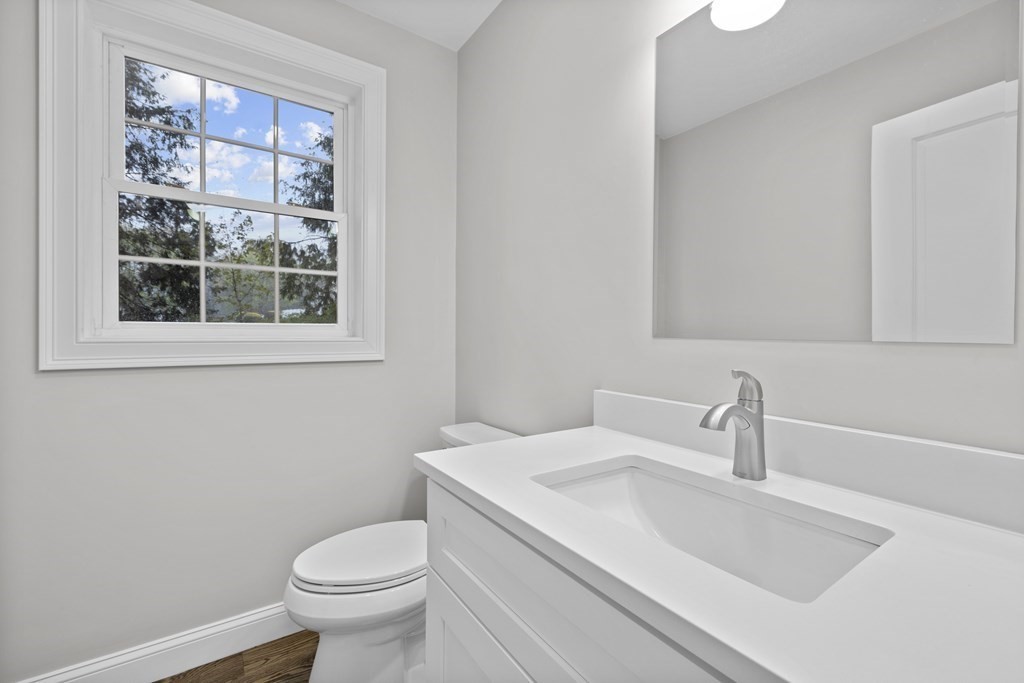 48 Aldrich Road Wilmington, MA 01887 - Photo 15 of 42 a bathroom with a sink a toilet and a window