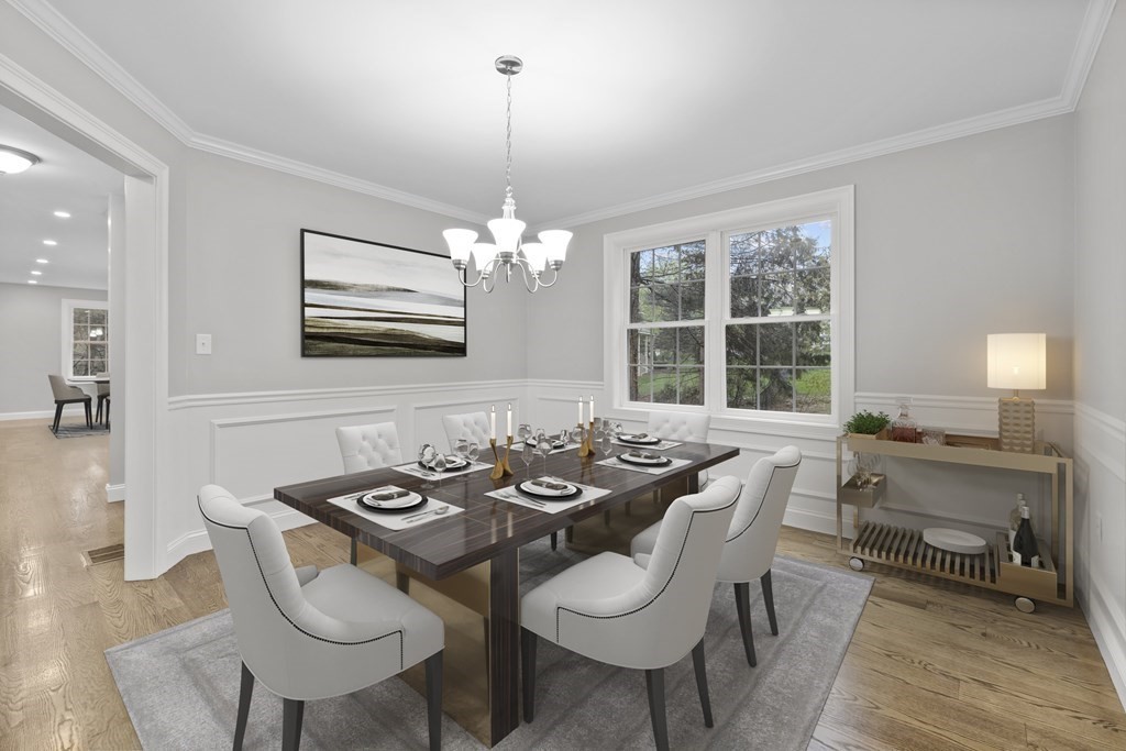 48 Aldrich Road Wilmington, MA 01887 - Photo 16 of 42 a view of a dining room with furniture wooden floor and chandelier