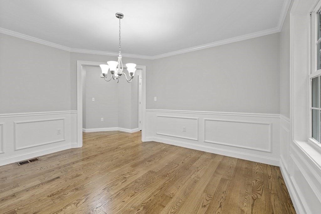 48 Aldrich Road Wilmington, MA 01887 - Photo 17 of 42 a view of a room with wooden floor and ceiling fan