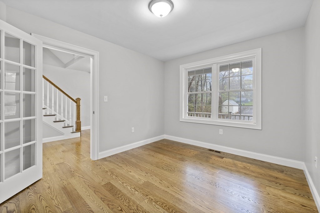 48 Aldrich Road Wilmington, MA 01887 - Photo 19 of 42 a view of an empty room with wooden floor and a window