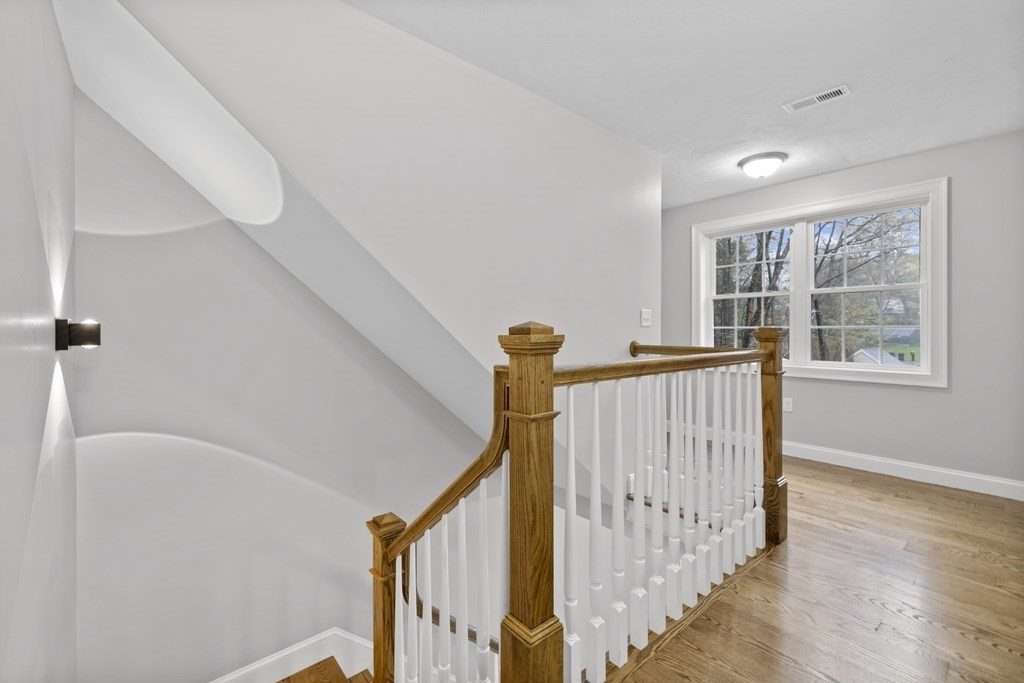 48 Aldrich Road Wilmington, MA 01887 - Photo 20 of 42 a view of entryway with stairs and wooden floor