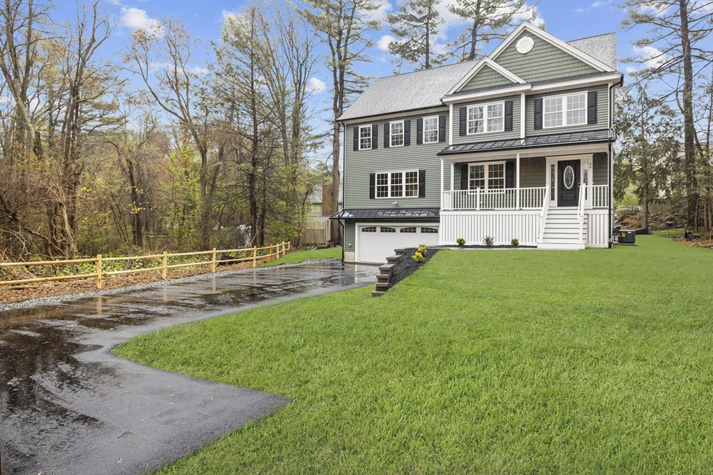 48 Aldrich Road Wilmington, MA 01887 - Photo 2 of 42 a front view of a house with a yard