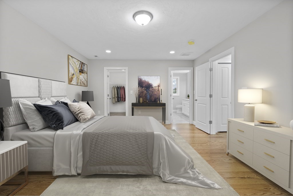 48 Aldrich Road Wilmington, MA 01887 - Photo 21 of 42 a spacious bedroom with a bed and a lamp