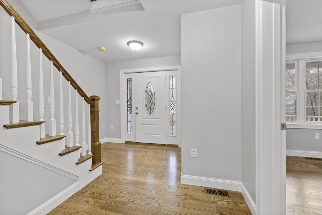 48 Aldrich Road Wilmington, MA 01887 - Photo 3 of 42 a view of entryway with wooden floor and stairs