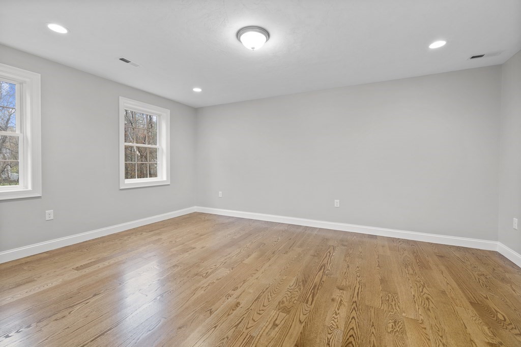 48 Aldrich Road Wilmington, MA 01887 - Photo 33 of 42 an empty room with wooden floor and windows