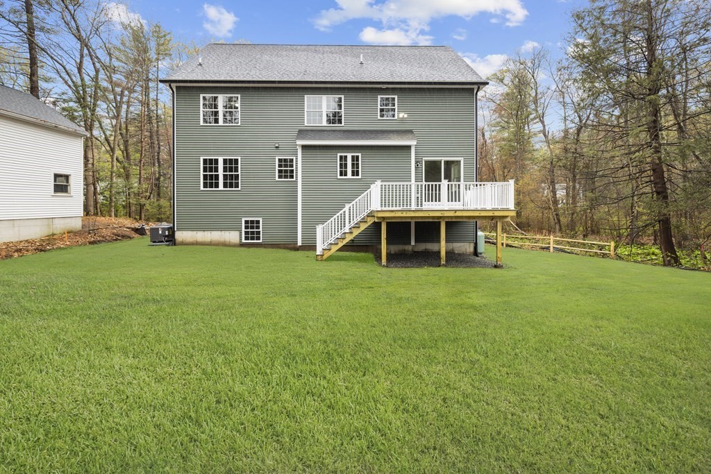48 Aldrich Road Wilmington, MA 01887 - Photo 41 of 42 a front view of a house with a yard