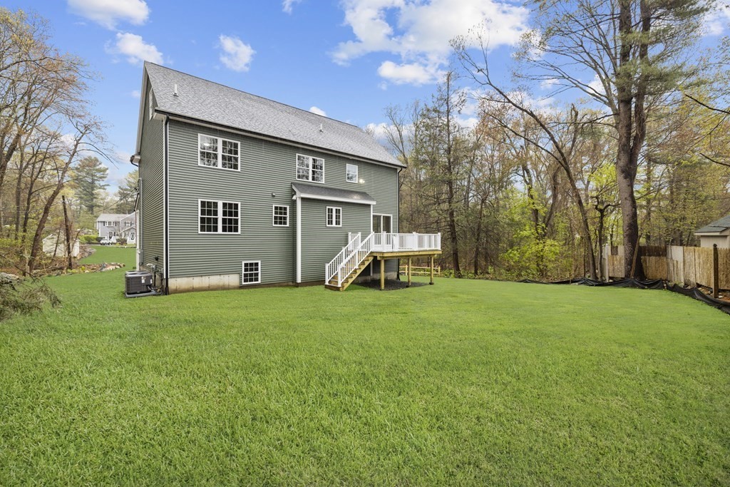 48 Aldrich Road Wilmington, MA 01887 - Photo 42 of 42 a front view of house with yard and trees