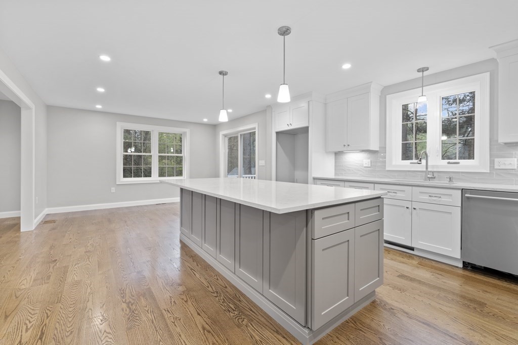 48 Aldrich Road Wilmington, MA 01887 - Photo 9 of 42 a kitchen with granite countertop a sink cabinets and wooden floor