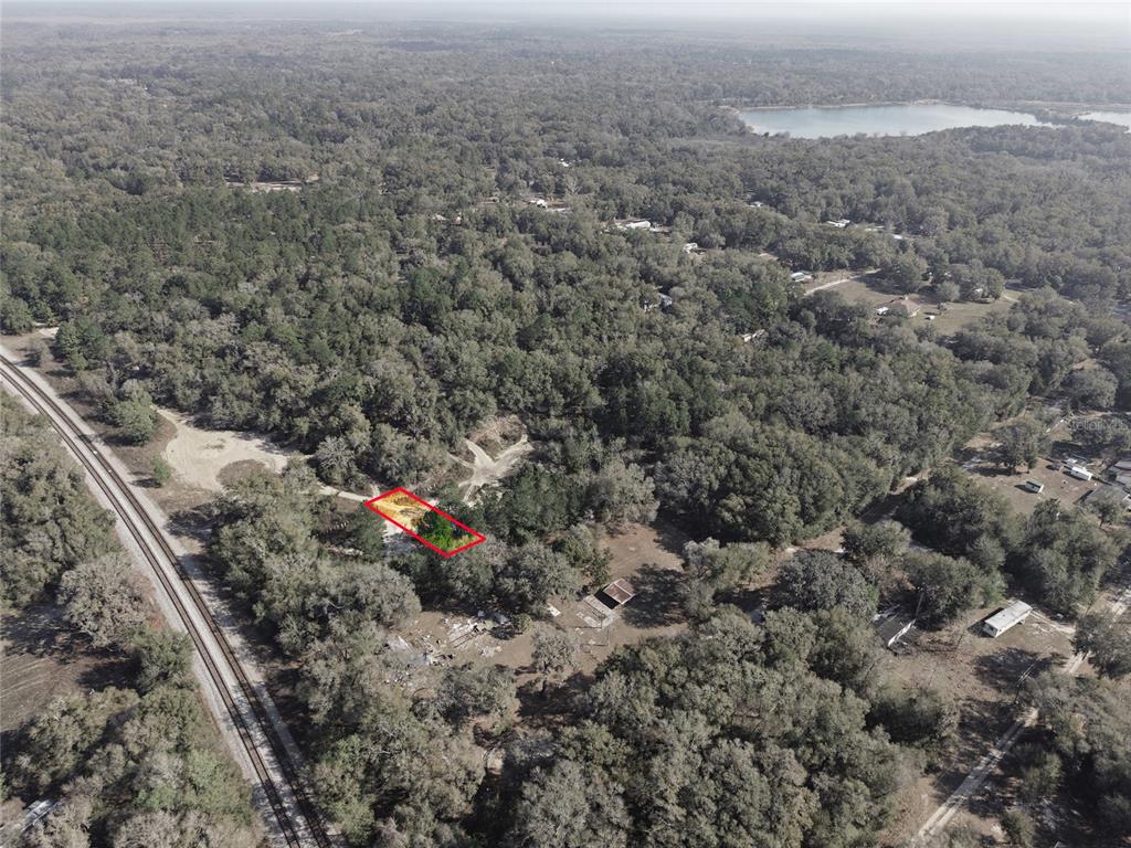 28 Northeast 164th Lane Citra, FL 32113 - Photo 11 of 29 an aerial view of house with yard and mountain view in back