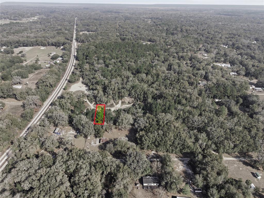 28 Northeast 164th Lane Citra, FL 32113 - Photo 13 of 29 an aerial view of house with yard and mountain in the background
