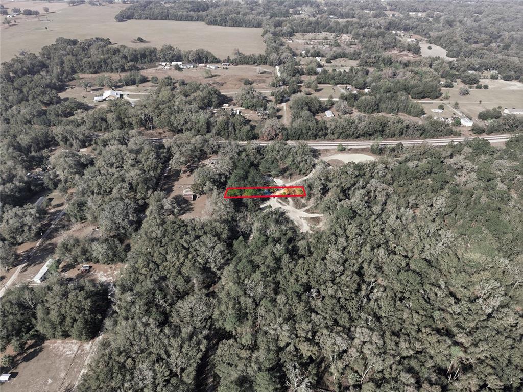 28 Northeast 164th Lane Citra, FL 32113 - Photo 4 of 29 an aerial view of a houses with a yard