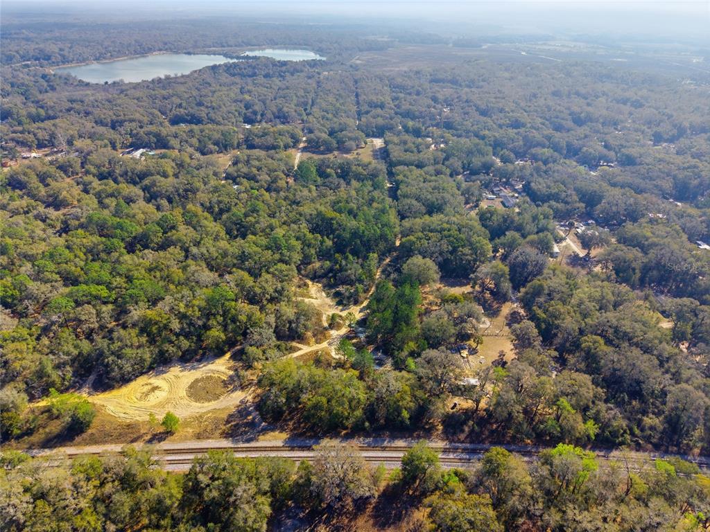28 Northeast 164th Lane Citra, FL 32113 - Photo 8 of 29 an aerial view of a house with a yard and lake view
