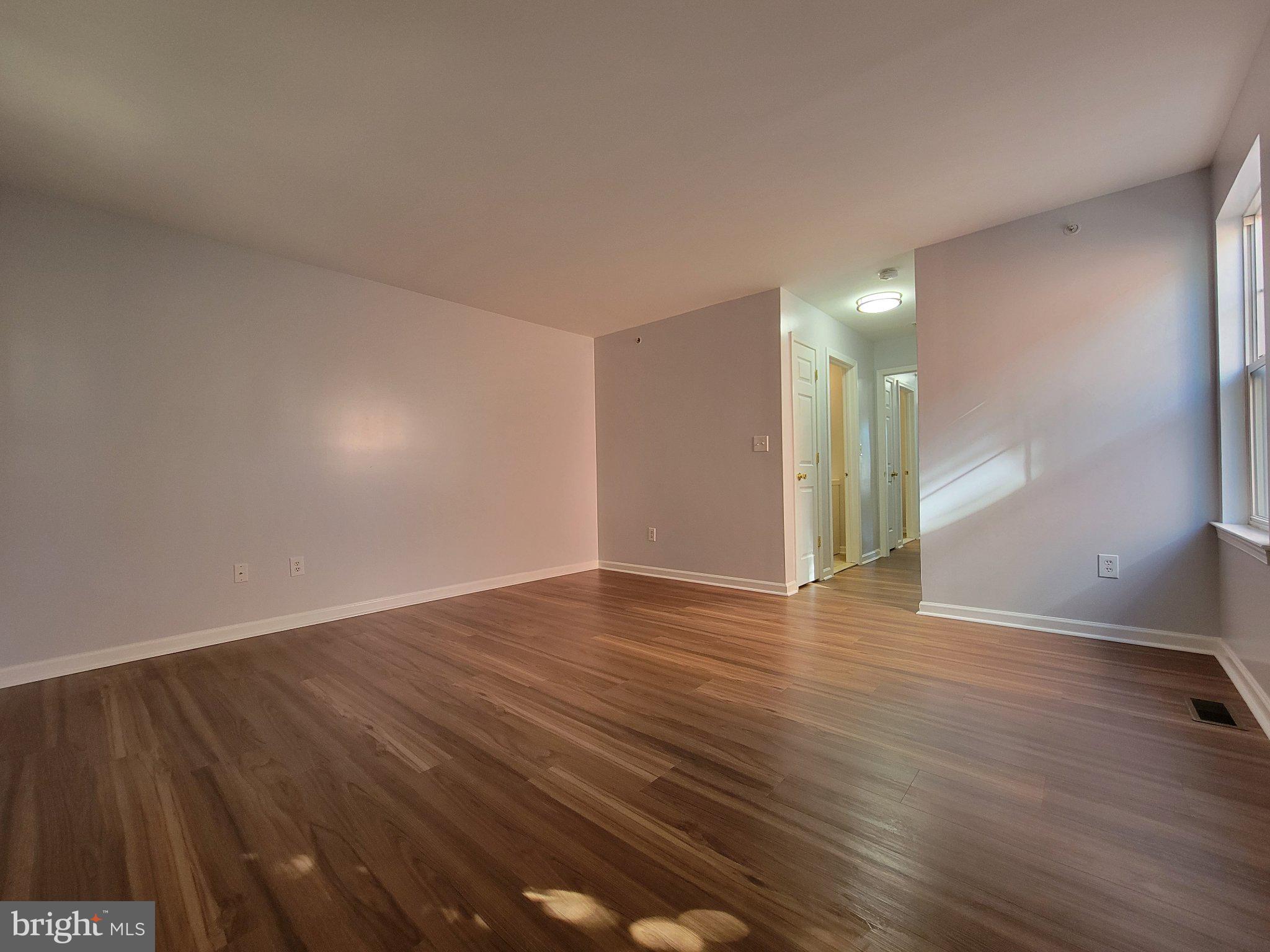 97 Spring Street Trenton, NJ 08618 - Photo 10 of 16 Spacious, sunlit room with warmth.