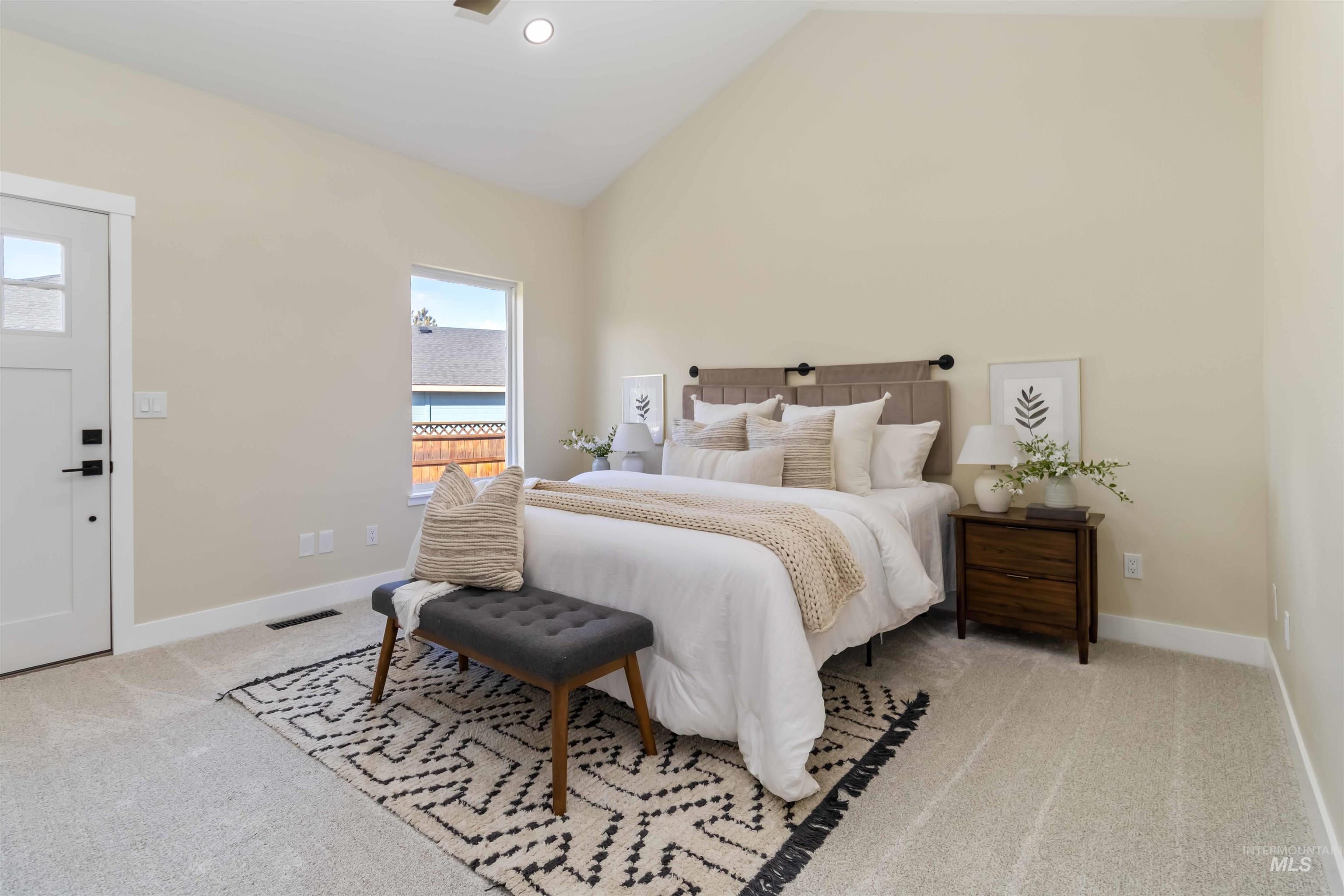3201 Raintree Drive Nampa, ID 83686 - Photo 18 of 50 Bedroom with light colored carpet and high vaulted ceiling