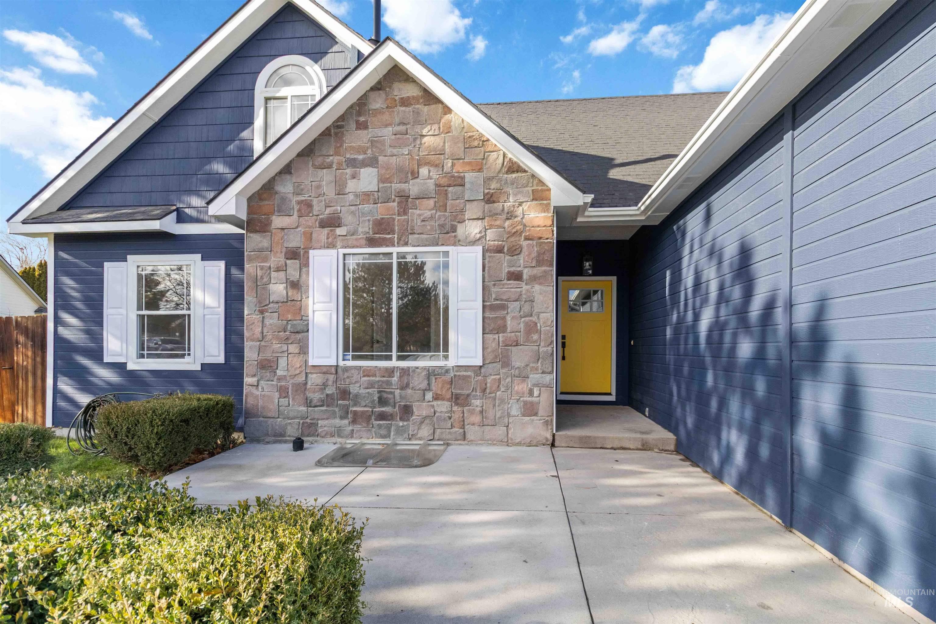 3201 Raintree Drive Nampa, ID 83686 - Photo 2 of 50 Entrance to property featuring stone siding and a patio area