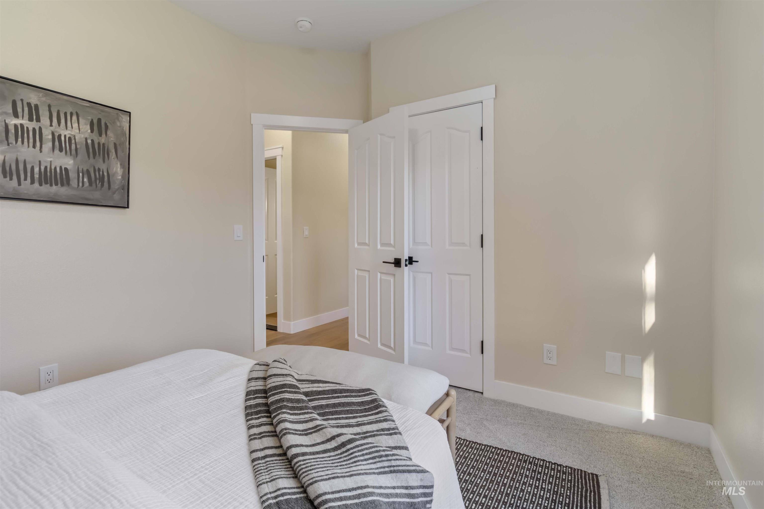 3201 Raintree Drive Nampa, ID 83686 - Photo 23 of 50 Bedroom featuring baseboards and light colored carpet
