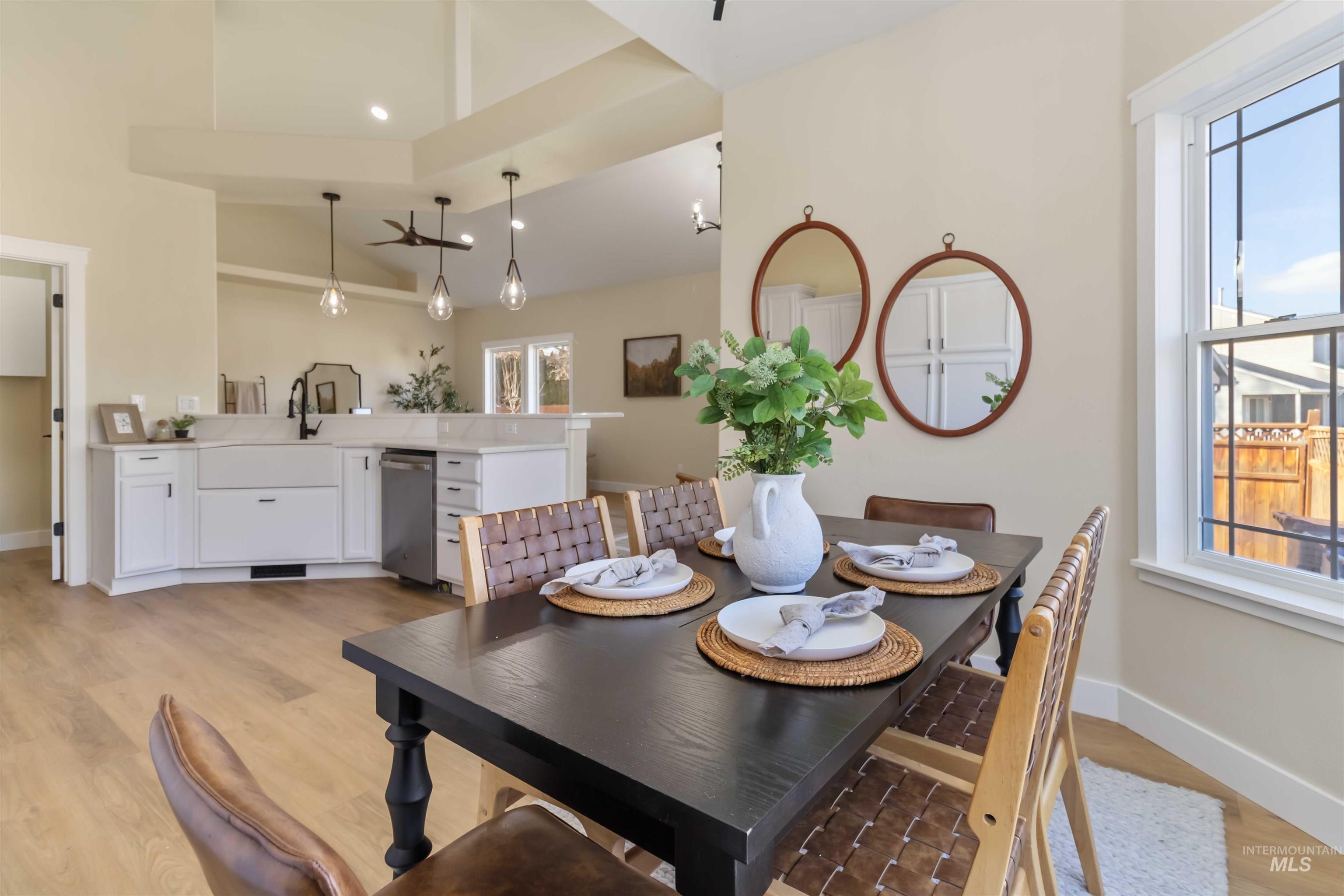 3201 Raintree Drive Nampa, ID 83686 - Photo 26 of 50 Dining area with light wood-style flooring and high vaulted ceiling