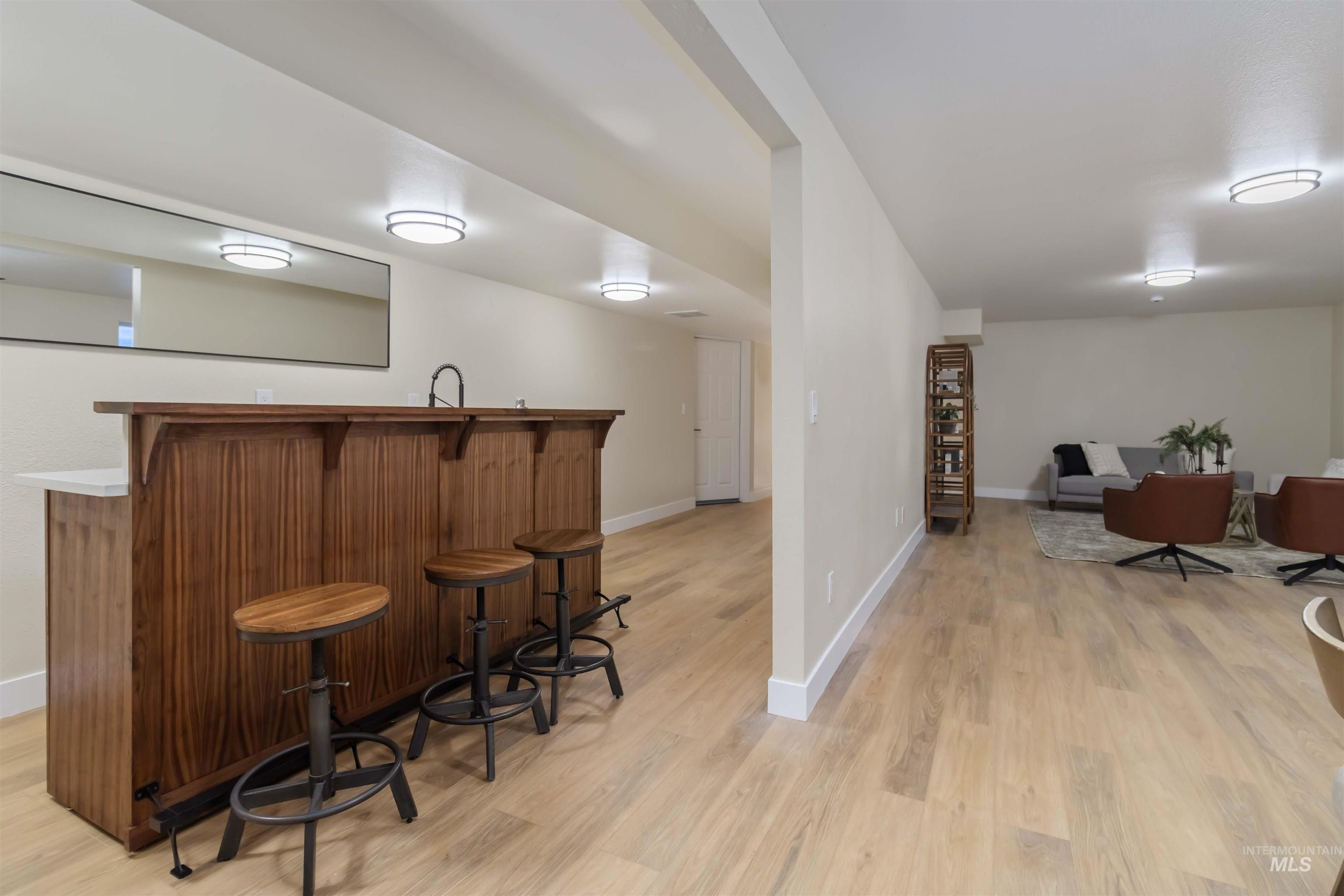 3201 Raintree Drive Nampa, ID 83686 - Photo 32 of 50 Indoor wet bar featuring light wood-type flooring