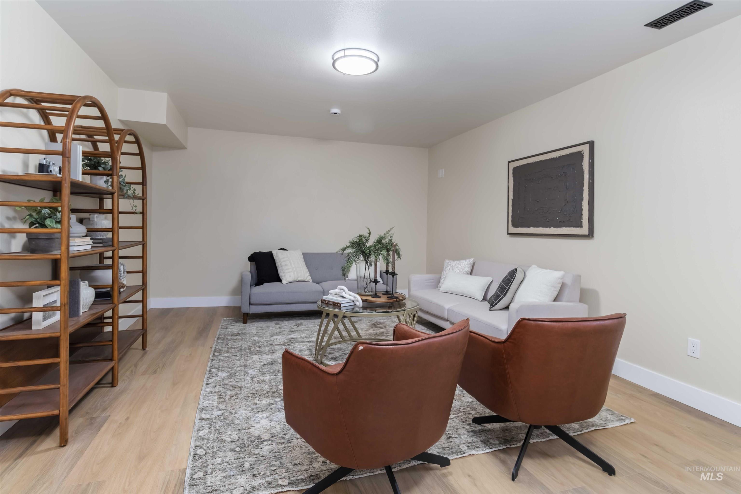 3201 Raintree Drive Nampa, ID 83686 - Photo 34 of 50 Living room with light wood-type flooring and baseboards
