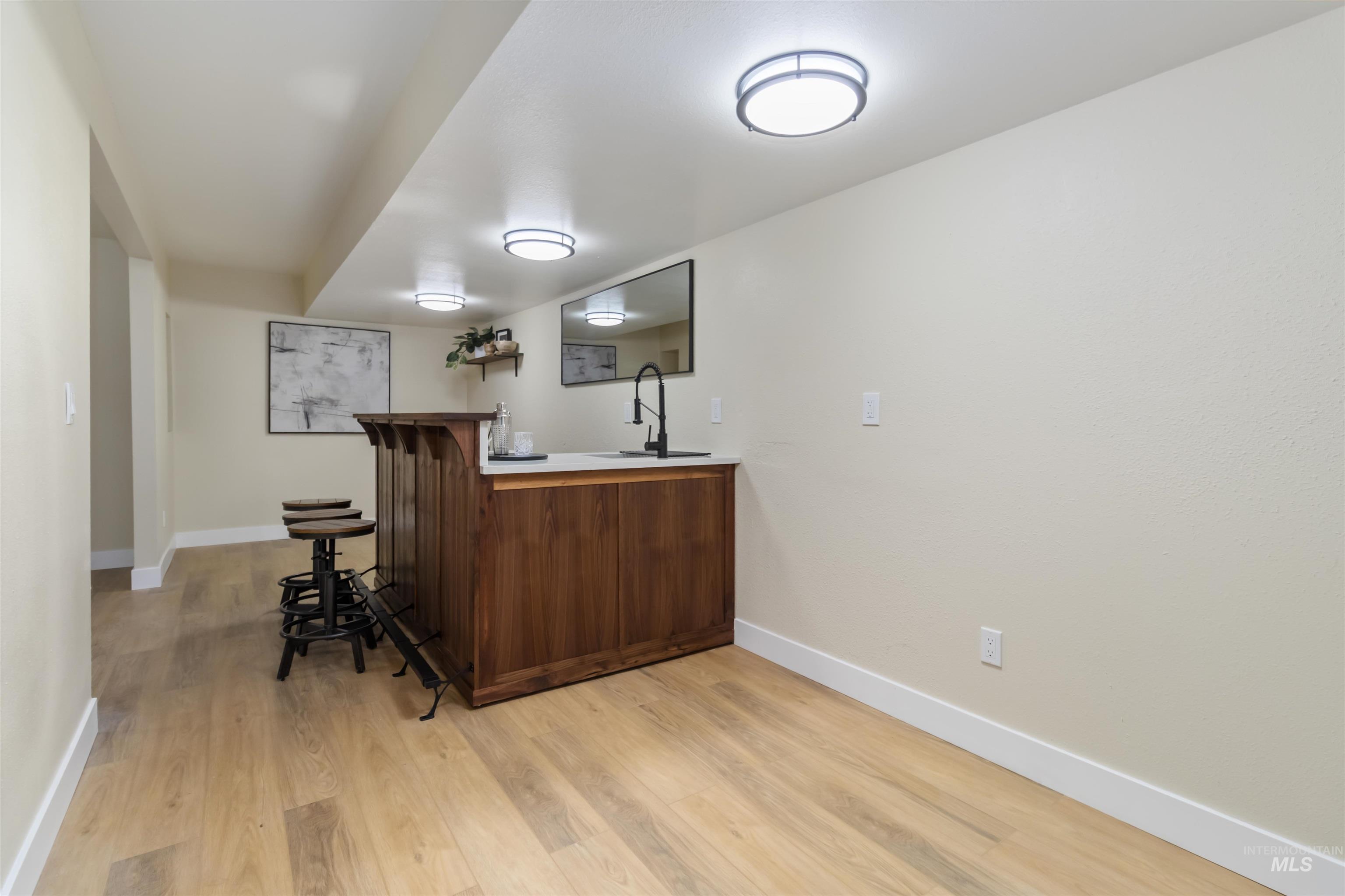 3201 Raintree Drive Nampa, ID 83686 - Photo 38 of 50 Bar area with light wood-style flooring and light countertops