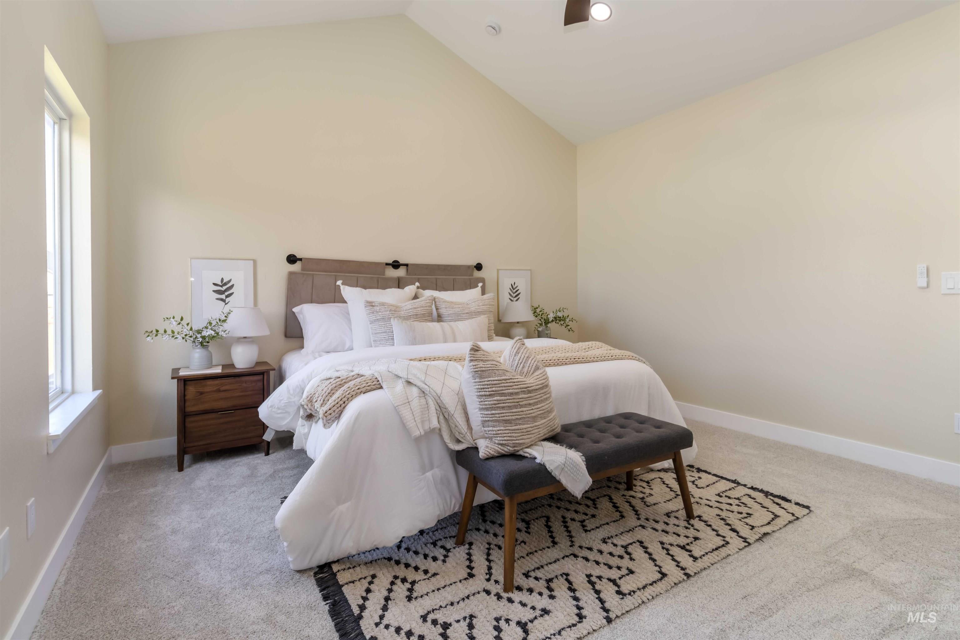 3201 Raintree Drive Nampa, ID 83686 - Photo 39 of 50 Bedroom featuring lofted ceiling, light carpet, a ceiling fan, and multiple windows