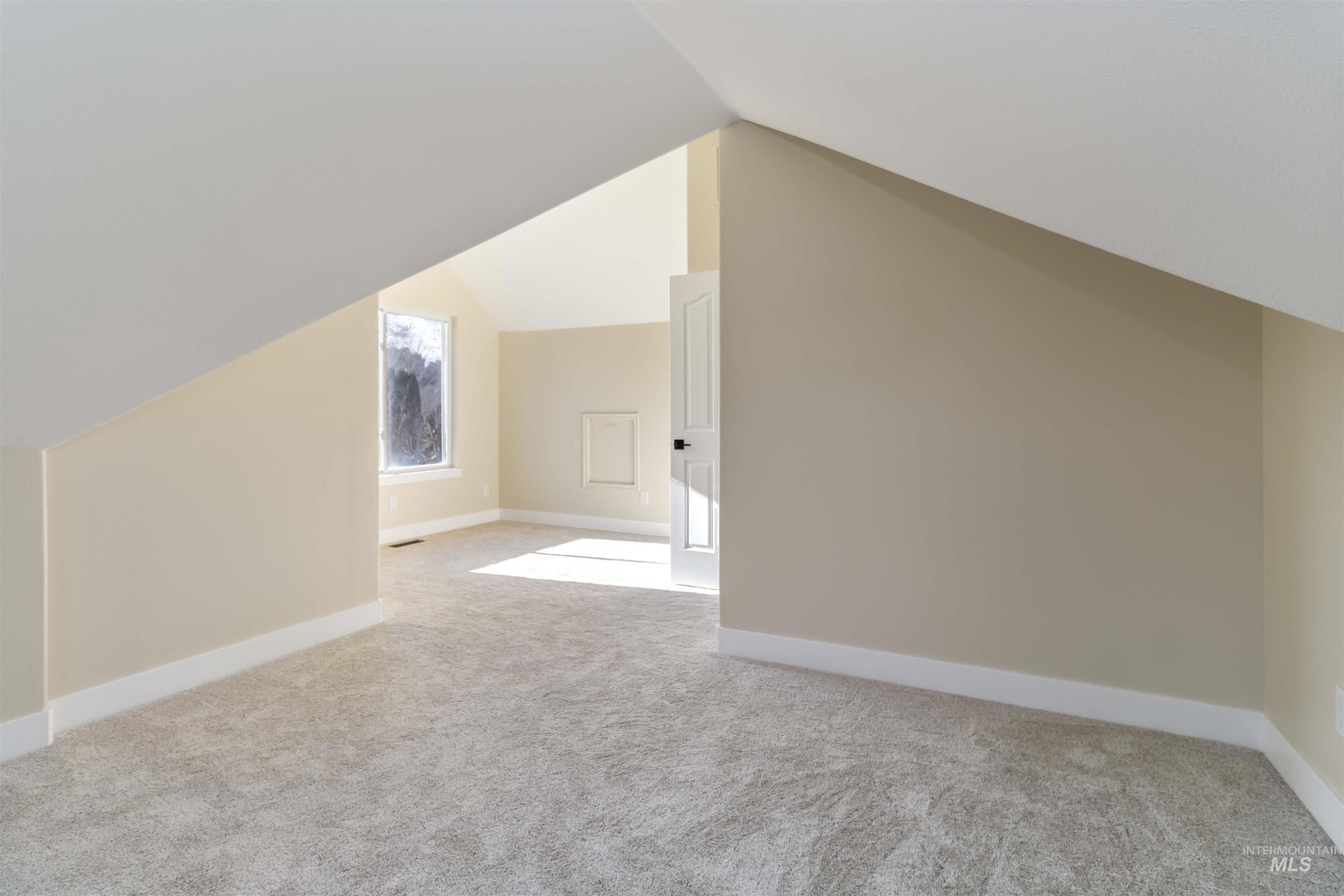 3201 Raintree Drive Nampa, ID 83686 - Photo 45 of 50 Bonus room featuring vaulted ceiling and light colored carpet