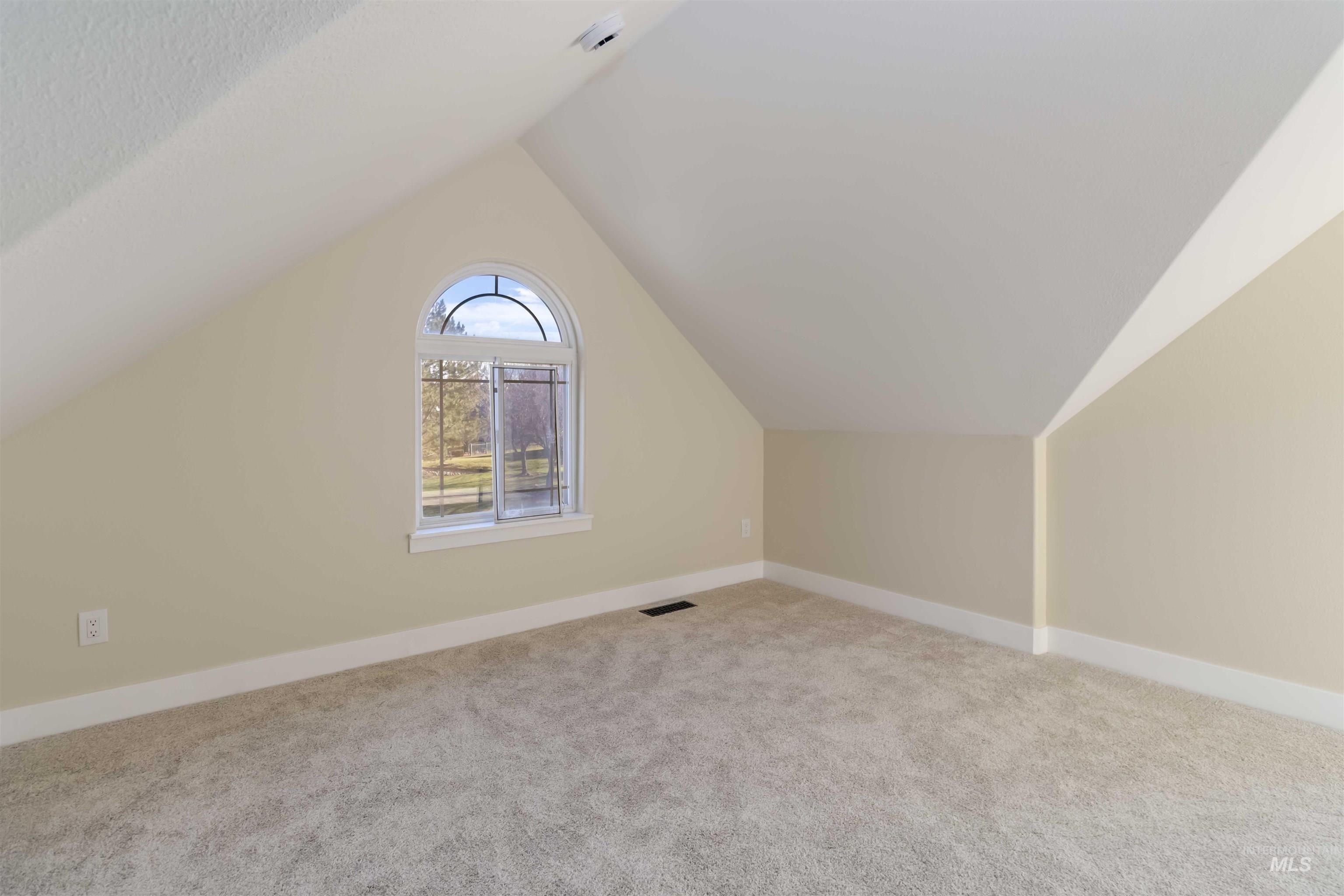 3201 Raintree Drive Nampa, ID 83686 - Photo 46 of 50 Additional living space featuring lofted ceiling and light carpet