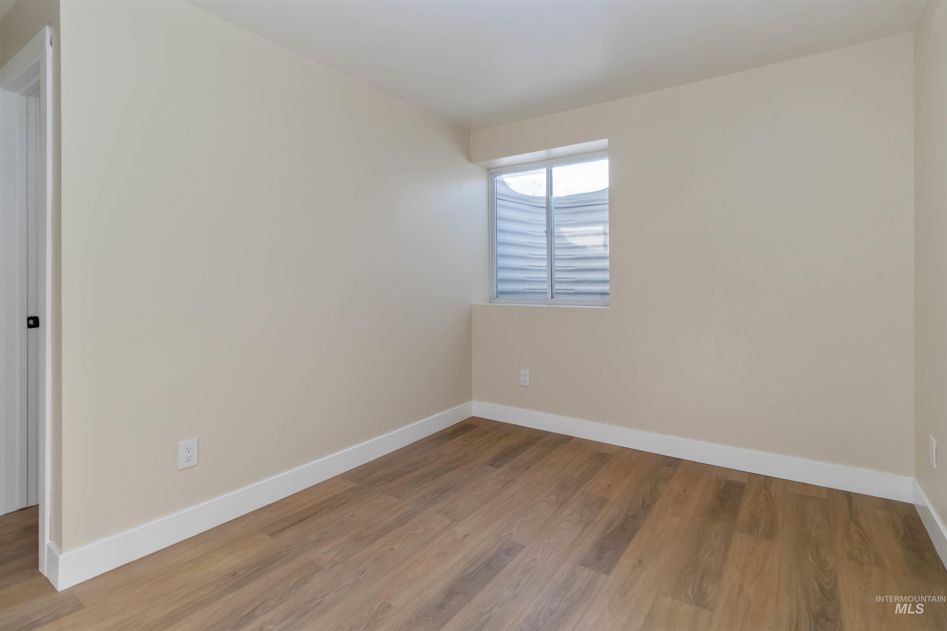 3201 Raintree Drive Nampa, ID 83686 - Photo 47 of 50 Unfurnished room featuring baseboards and wood finished floors