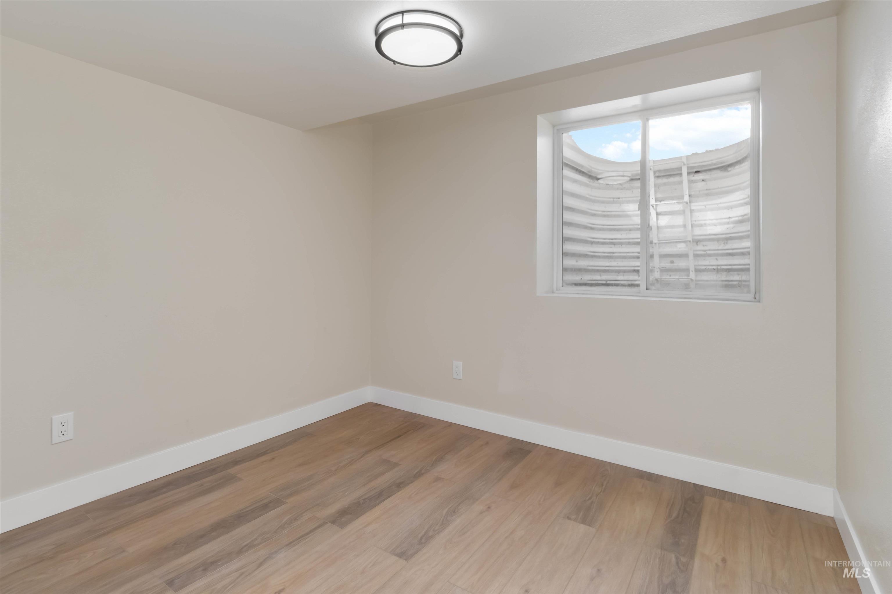 3201 Raintree Drive Nampa, ID 83686 - Photo 49 of 50 Spare room featuring wood finished floors and baseboards
