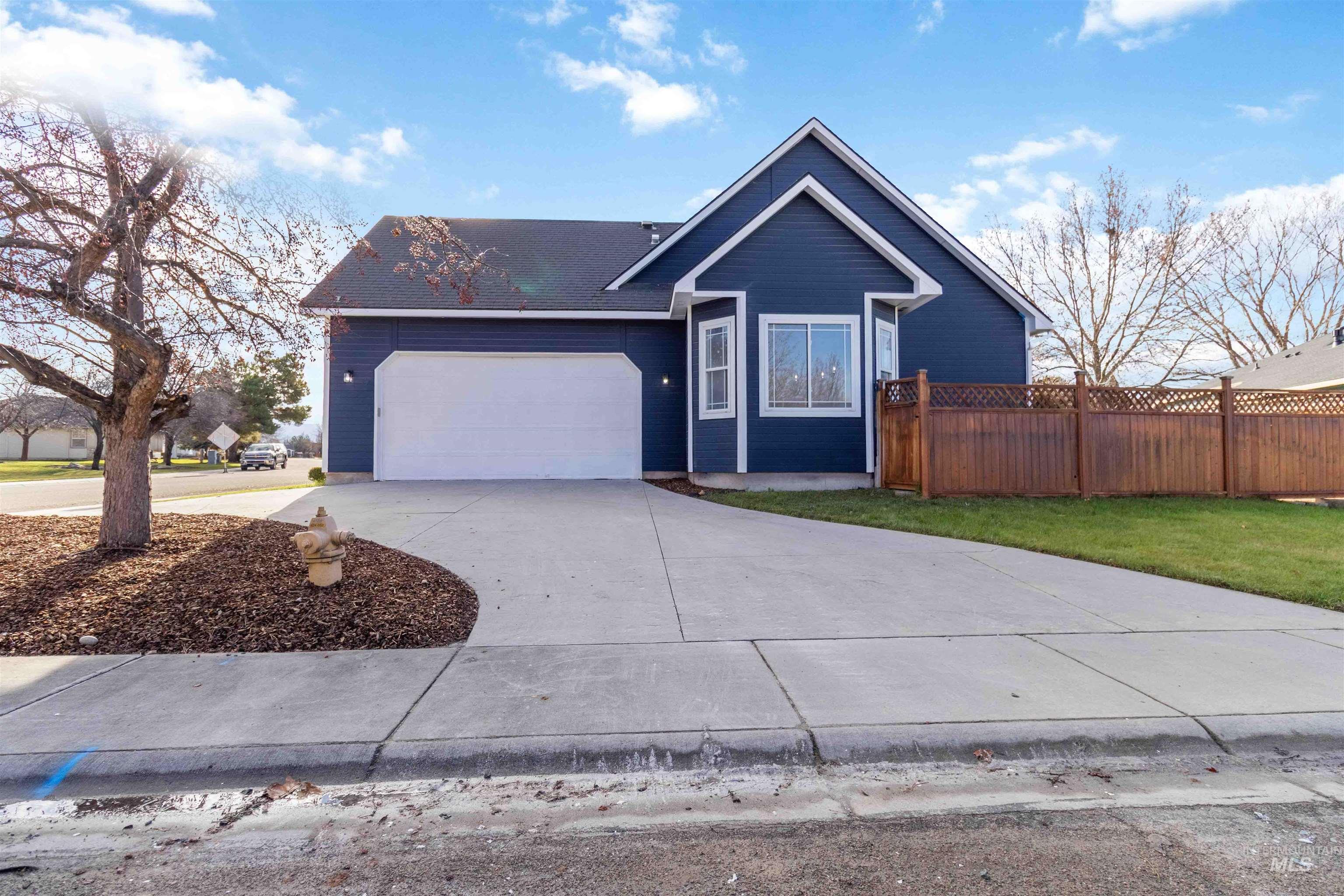 3201 Raintree Drive Nampa, ID 83686 - Photo 6 of 50 Ranch-style home featuring concrete driveway and an attached garage