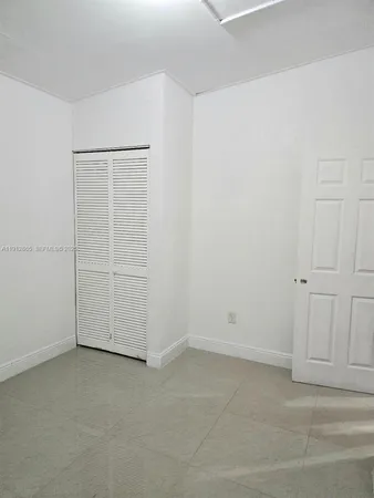 an empty room with closet