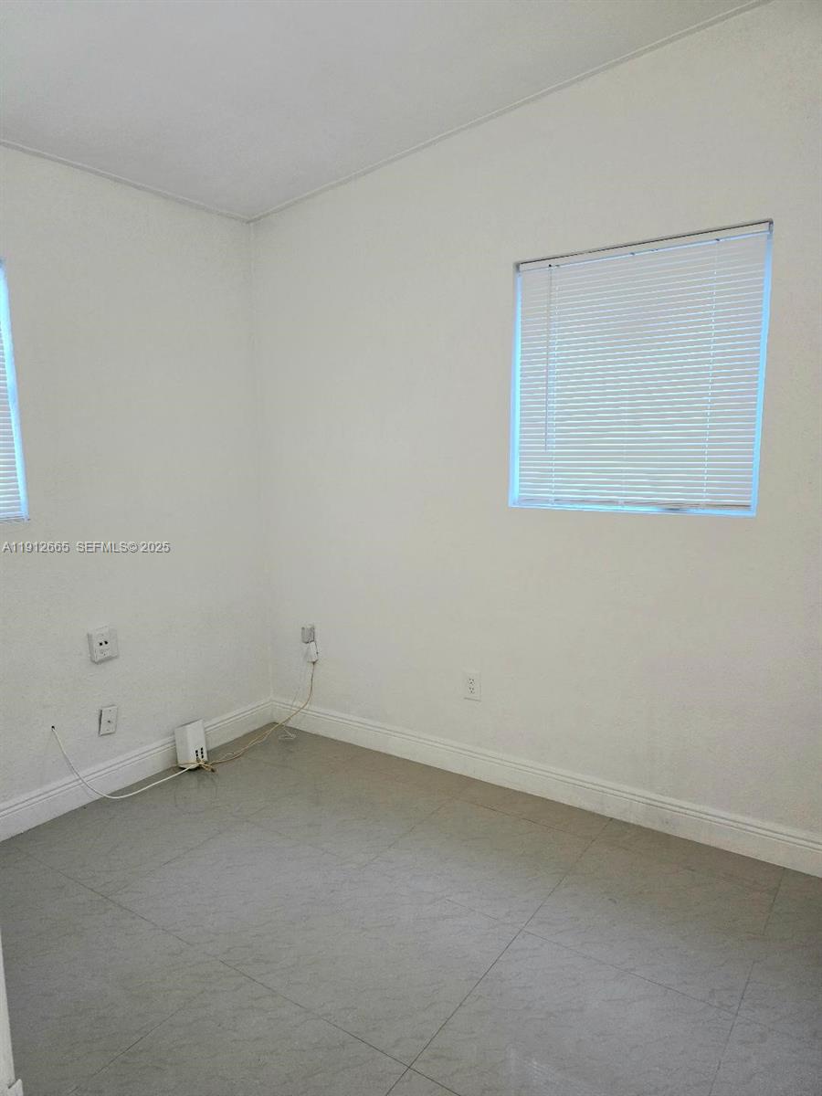 3621 Southwest 47th Avenue West Park, FL 33023 - Photo 5 of 10 an empty room with a empty space