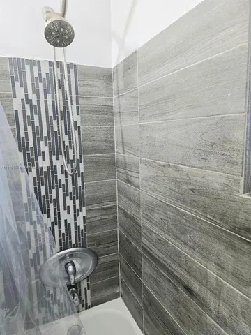 a utility room with washing machine