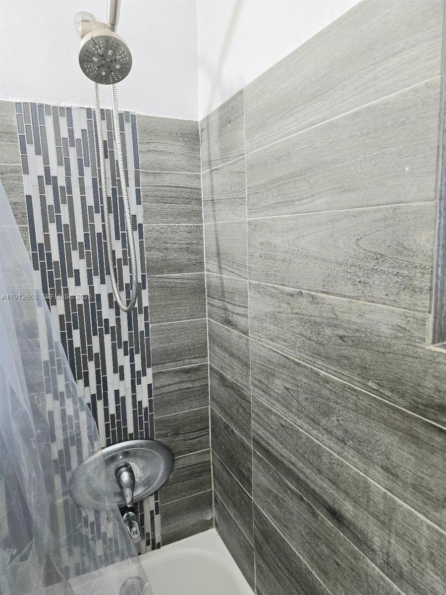 3621 Southwest 47th Avenue West Park, FL 33023 - Photo 8 of 10 a bathroom with a toilet and a shower