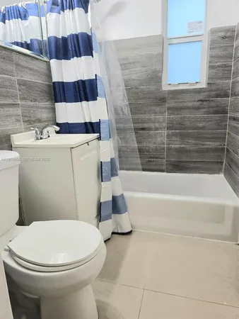 a utility room with washing machine