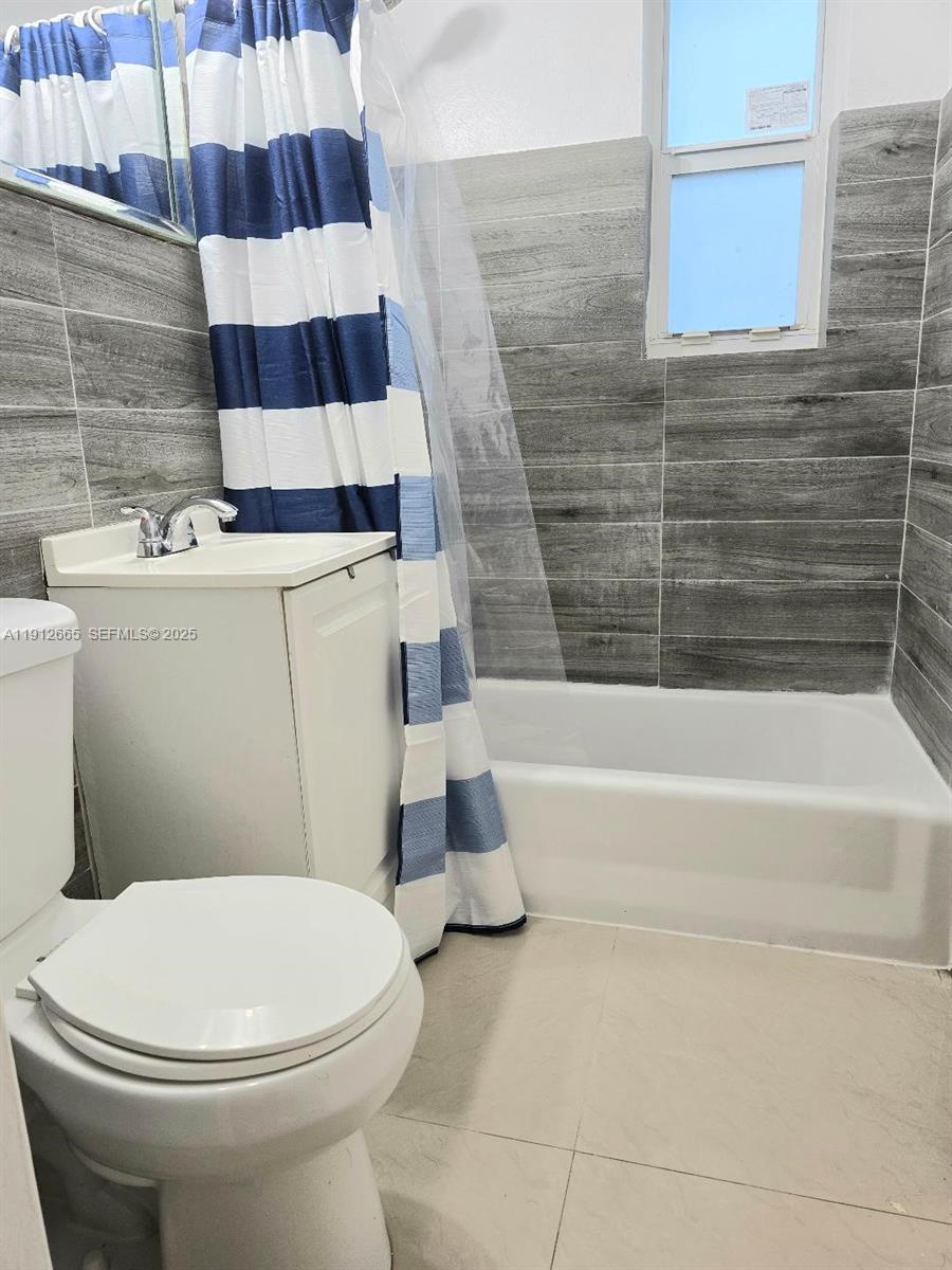 3621 Southwest 47th Avenue West Park, FL 33023 - Photo 9 of 10 a bathroom with a toilet and a shower