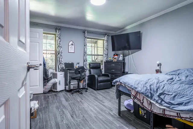 a bed room with bed and a window