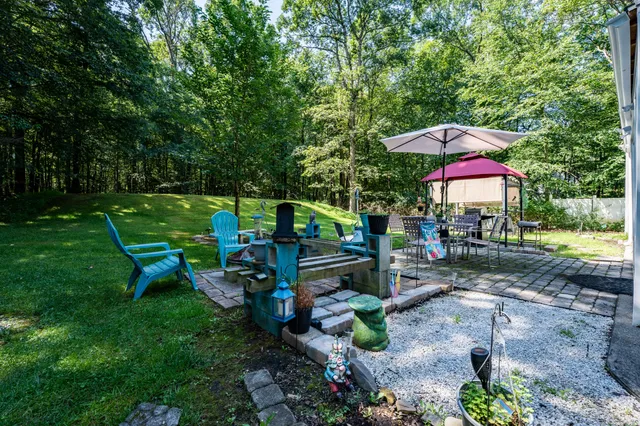 a view of a park with a bench and a table