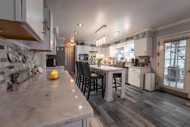 a kitchen with a sink appliances and cabinets