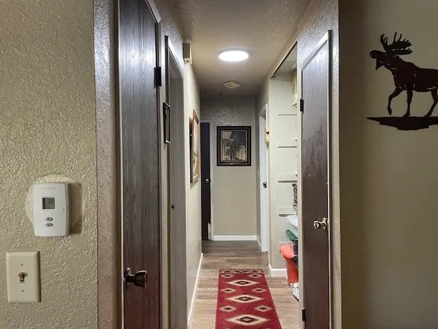 a bathroom with a toilet and a refrigerator