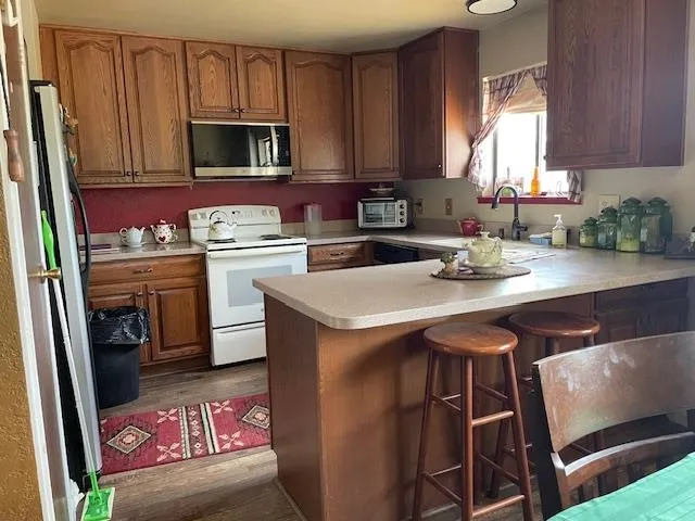 a kitchen with a sink cabinets and appliances