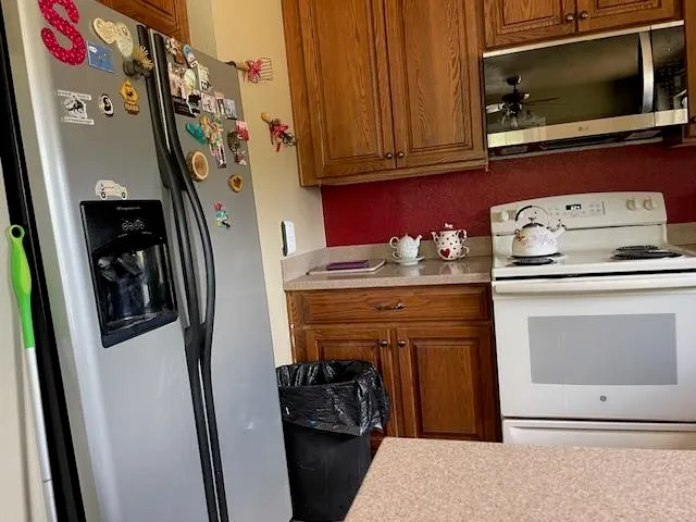 a kitchen with a stove and a microwave