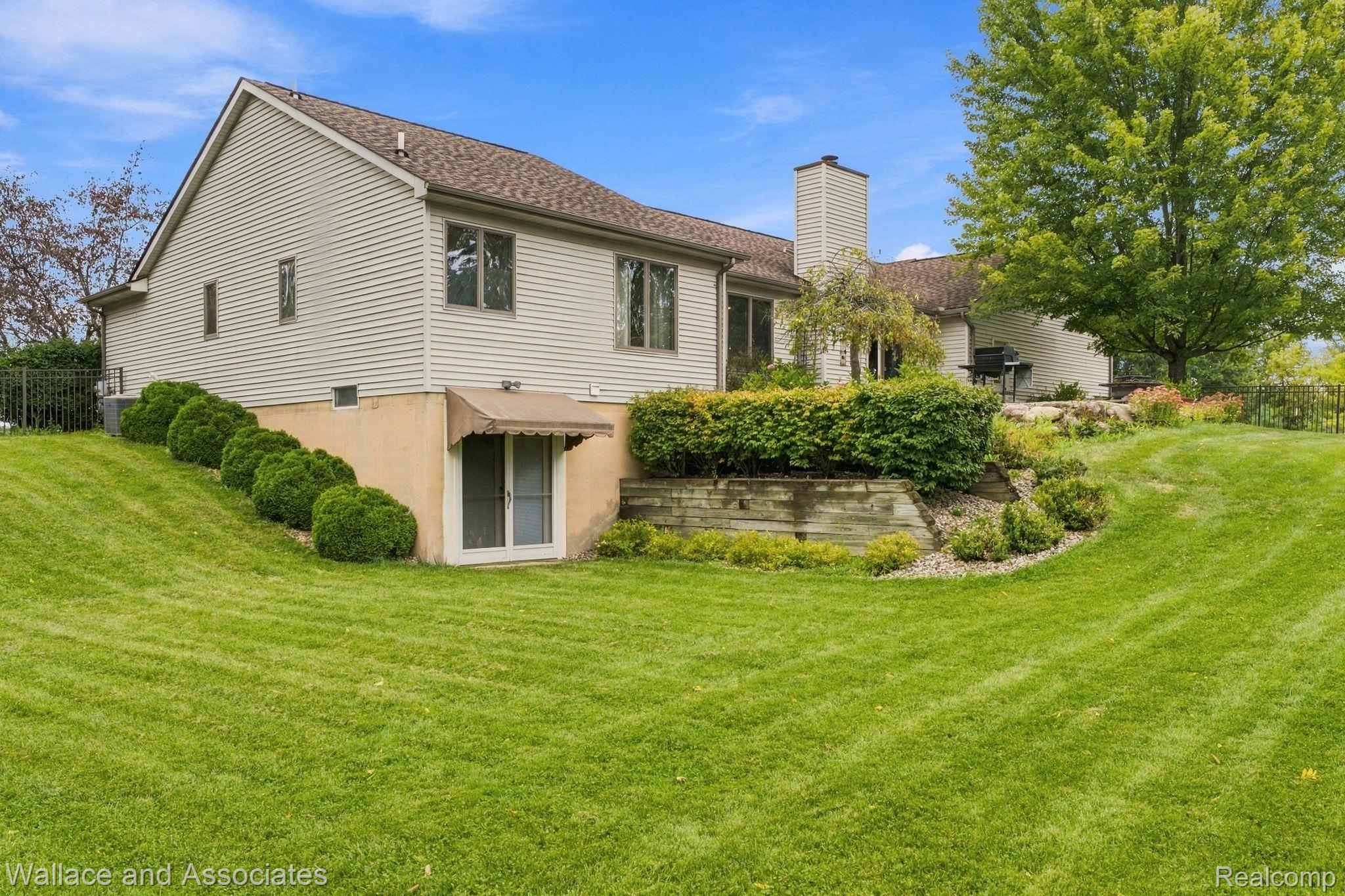 17076 27 Mile Road Ray, MI 48096 - Photo 59 of 63 Expansive rear lawn with mature trees and established landscaping