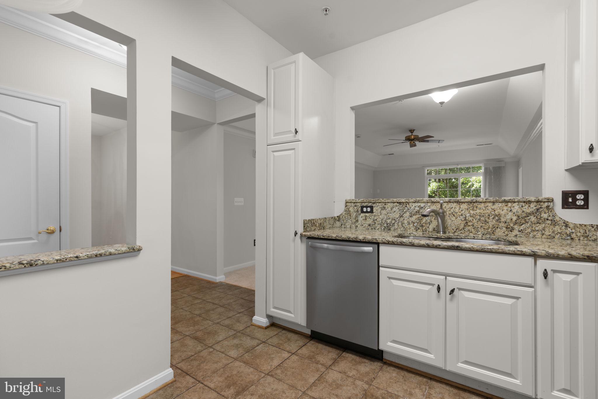 7315 Maplecrest Road, Unit 104 Elkridge, MD 21075 - Photo 21 of 58 a bathroom with a granite countertop sink and a mirror