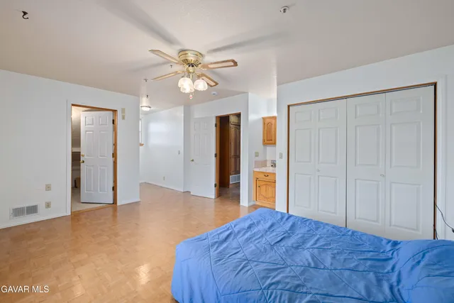 a view of a room with water heater and wooden floor