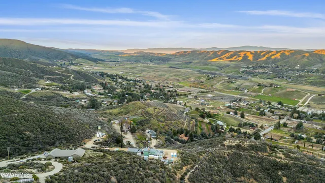 a view of a town with mountains in the background