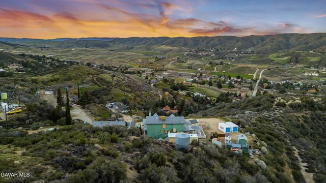 a view of a town with mountains in the background